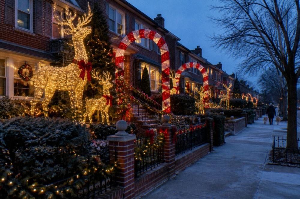 Row of Brooklyn houses covered in oversized holiday light displays
